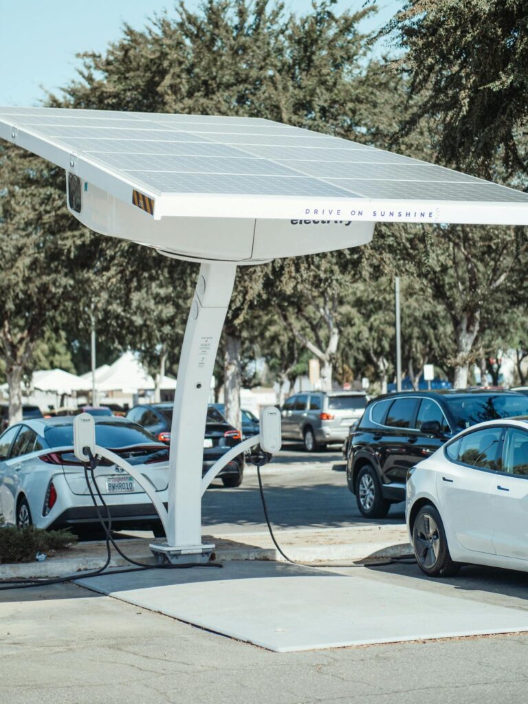 Eco-friendly solar panel charging station for electric vehicles outdoors.